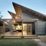 Ilustrasi fasad rumah tropis modern dengan atap miring dan ventilasi roster tahun 2025